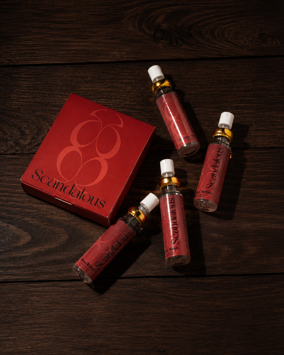 Scandalous experiential discovery set of four travel sprays with branded box